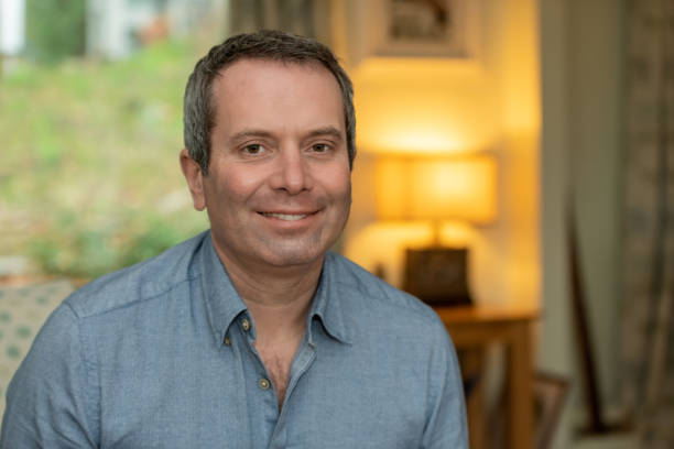 istock Middle aged man smiles at camera 1197825539