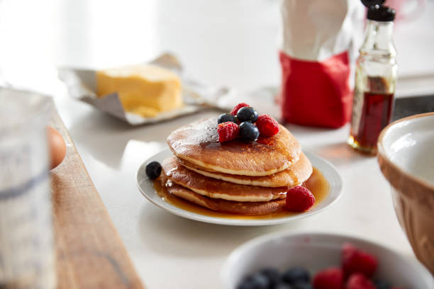 istock Stack Of Freshly Made Pancakes Or Crepes With Maple Syrup And Berries On Table For Pancake Day 1197828803