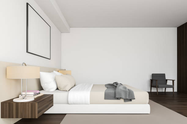 istock Side view of white bedroom with poster 1197833626