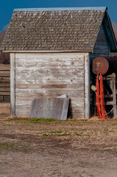 istock Bailing line near the shady side of a small whitewashed shed 1197835487