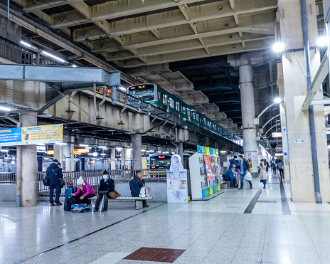 Tokyo, Japan - February 5, 2019: Commuters at Japanese subway station