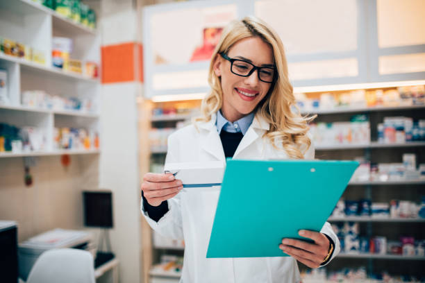 istock Young pharmacist making a medicine checklist 1197837486