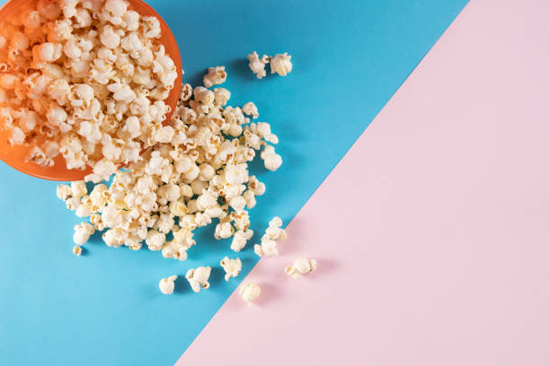 istock Popcorn on Pink and Blue Background 1197837645