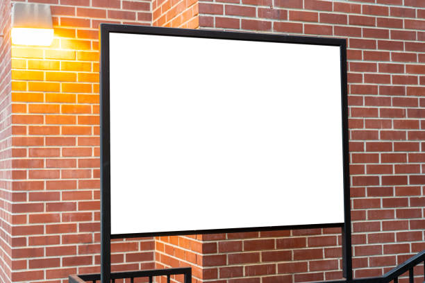 istock Square billboard in front of a brick wall. 1197837852