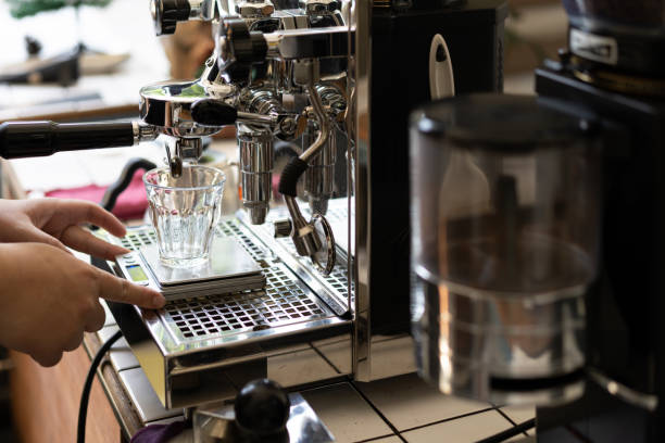 istock Barista Making Espresso with Coffee Machine 1197838509