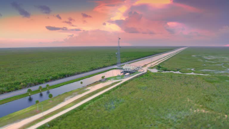 AERIAL Road through the Everglades, FL at sunset