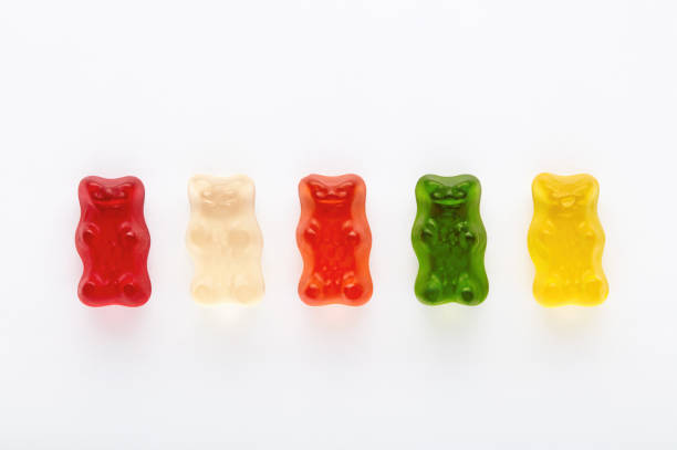 istock Selection of colorful gummy bears on white background 1197839581