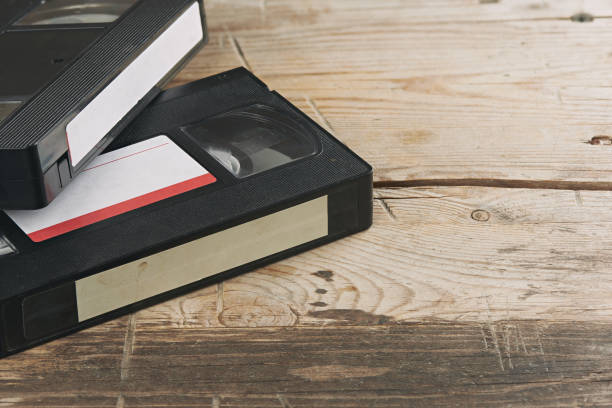 istock stack of video tape cassettes over wooden background 1197839813