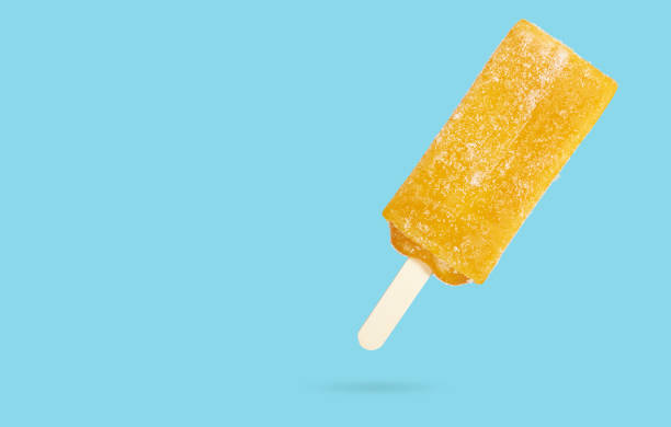 istock Yellow mango fruit popsicle ice cream stick isolated 1197840851