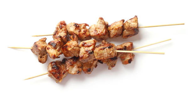 Pork shish kebab isolated on white background, top view Pork shish kebab isolated on white background, top view skewer photos stock pictures, royalty-free photos & images