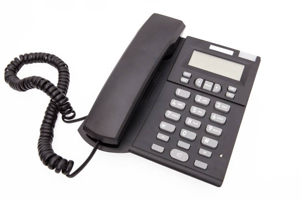 istock Modern black color desk telephone isolated on white background. 1197843385