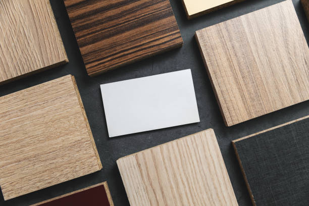 istock furniture material samples with blank business card on black stone background 1197844714