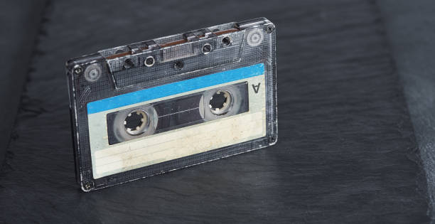 istock Old audio tape compact cassette on stone background 1197845071