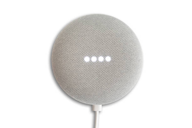 top view of Google Home Mini smart speaker while activated isolated on white background Hamburg, Germany January 06 2020: top view of Google Home Mini smart speaker while activated isolated on white background google home stock pictures, royalty-free photos & images