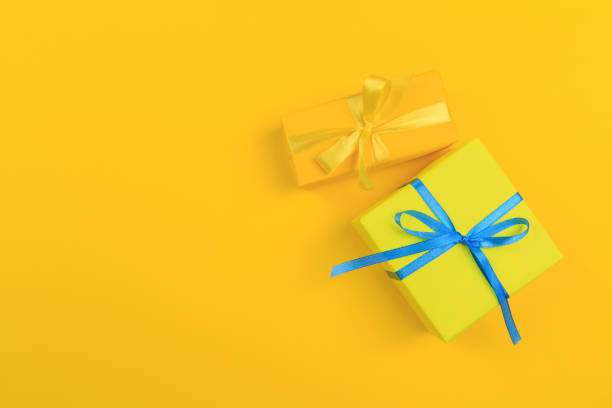istock Different colored gift box on color background. Top view of various present boxes on minimal background. Birthday, Christmas, wedding, valentine, romantic gifts 1197846667