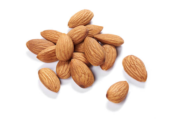 istock heap of almond nuts isolated on white background 1197848733