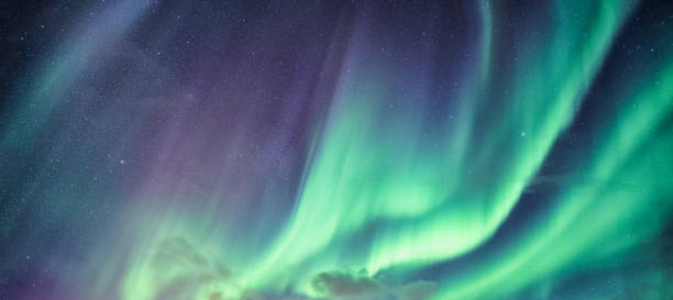 istock Northern lights, Aurora borealis with starry in the night sky 1197849622