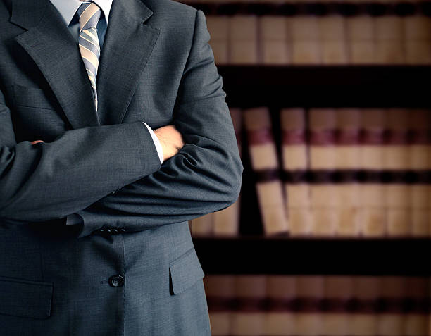 istock Businessman in front of books 119785384