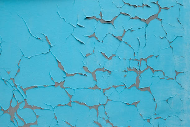 istock Blue wall texture with cracked old paint 1197856102