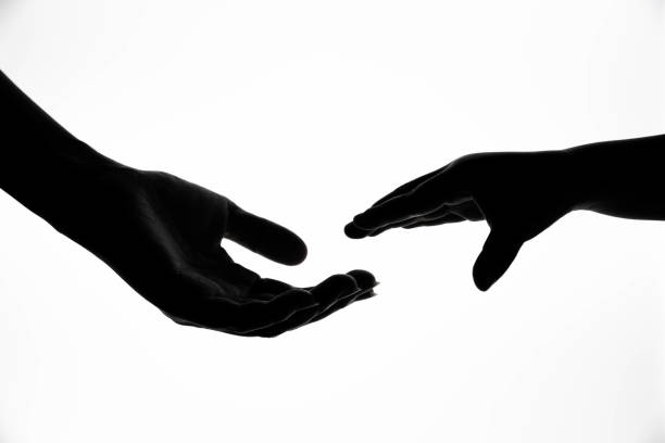 istock Mother and child shaking hands silhouette 1197856251