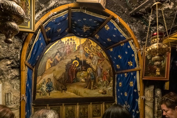 the interior of the christmas cave in the church of nativity in bethlehem in palestine - franciscan imagens e fotografias de stock