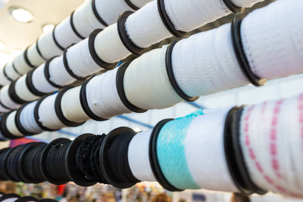 istock Many coils with white textile ribbons. 1197856533
