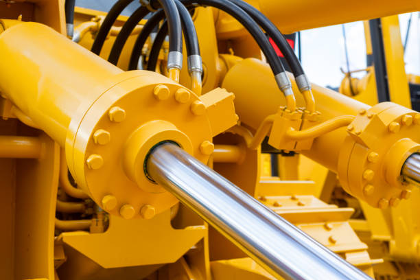 Powerful hydraulic cylinders. The main power and driving element for construction equipment Powerful hydraulic cylinders. The main power and driving element for construction equipment. hydraulic platform stock pictures, royalty-free photos & images