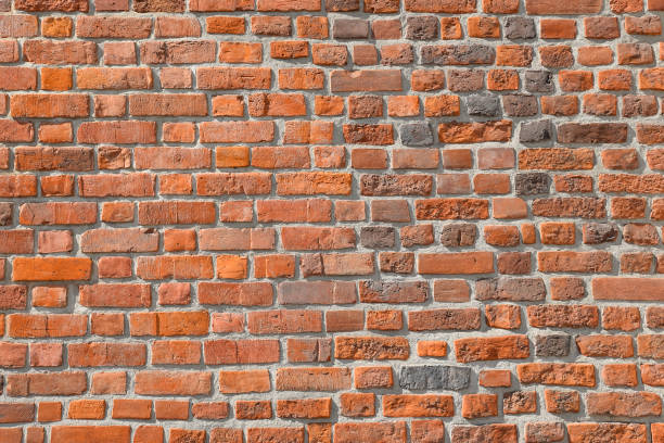 istock Brick wall background. Texture of a brick wall. Modern wallpaper design for web or graphic art projects. 1197858333
