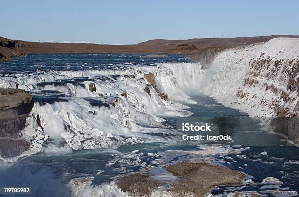 Congelato Cascate Gullfoss In Islanda - Fotografie stock e altre immagini di Acqua - Acqua, Acqua fluente, Ambientazione esterna