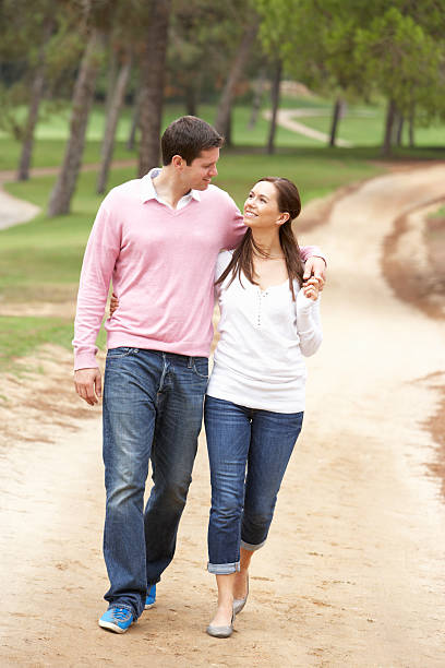 istock Romantic couple enjoying walk in park 119786311