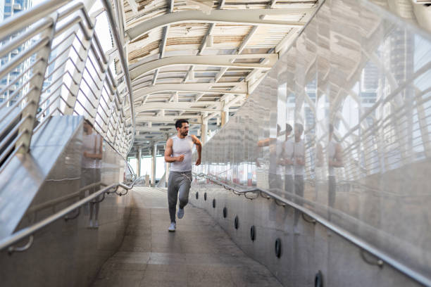 istock American bearded man running in city 1197863421