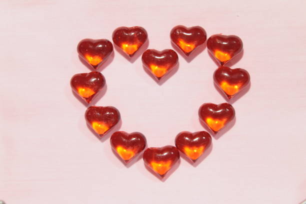 istock Glass hearts on a pink background. 1197863711