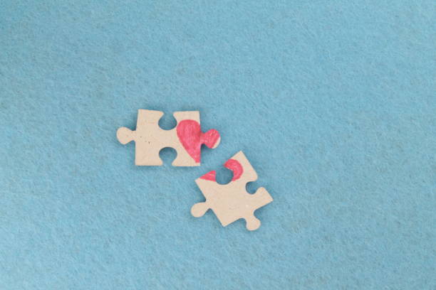 istock Puzzle with a heart on the blue background. 1197864879