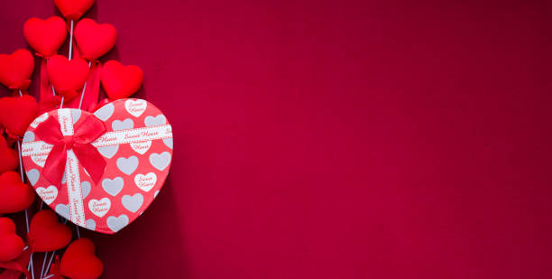 gift box on red cloth. red striped hearts - valentine imagens e fotografias de stock