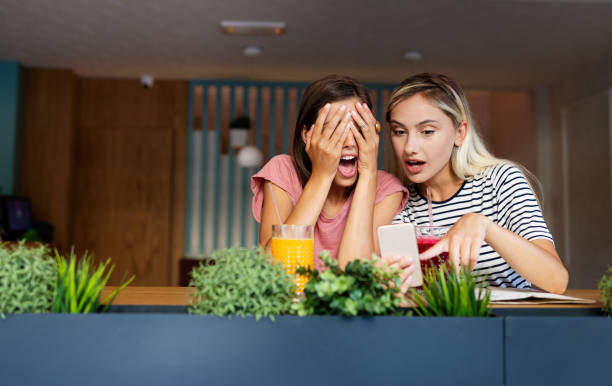 istock Young female friends talking, smiling and having fun together 1197868645