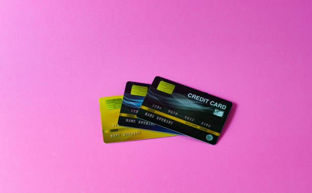 istock Credit card on pink background 1197869016