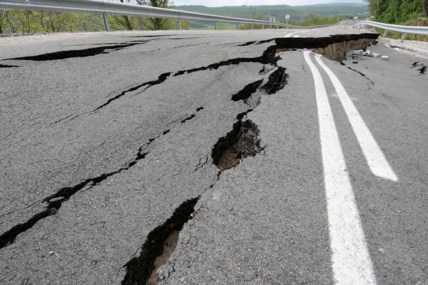 istock Road collapses with huge cracks.Earthquake. 1197870300