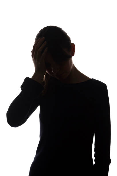 istock Silhouette young girl with problems, hands on her head - isolated 1197871726