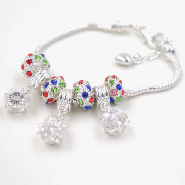 istock Isolated snake chain silver bracelet with crystal beads on the white background 1197871912