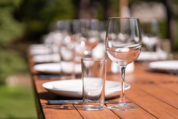 istock Served wooden table without a tablecloth. Cafe in the open air park 1197875838