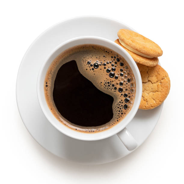Cup of black coffee with biscuits. Cup of black coffee and crunchy cream oat biscuits with vanilla filling. Top view. black coffee stock pictures, royalty-free photos & images