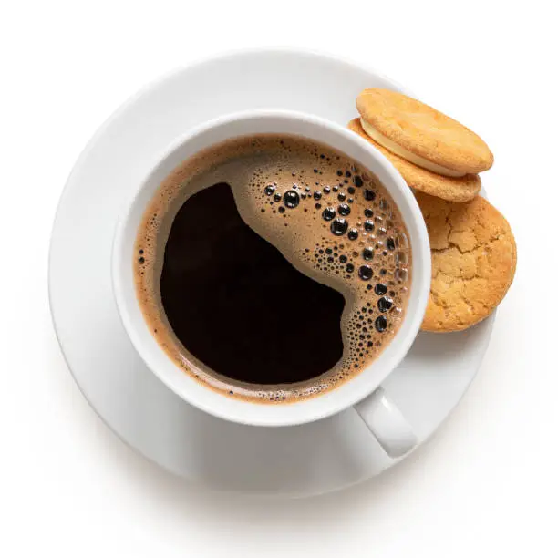 Photo of Cup of black coffee with biscuits.