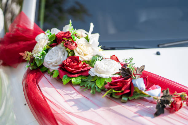 istock White wedding car decorated with fresh flowers. Wedding decorations. 1197876241