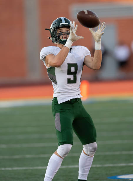 istock Young Football Player in Action During a Game 1197876483