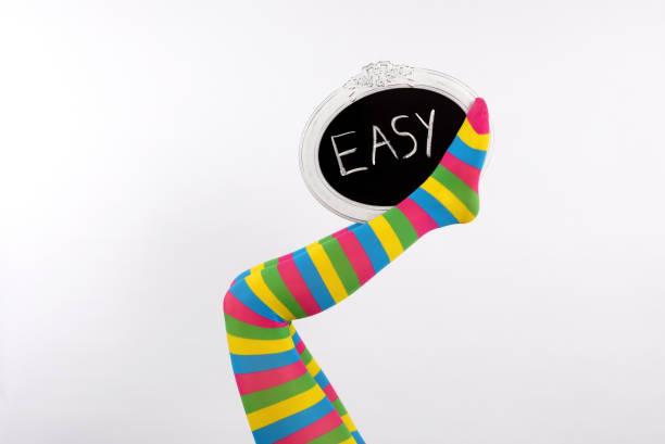 istock Colored Legs With A Chalkboard Sign 1197882151