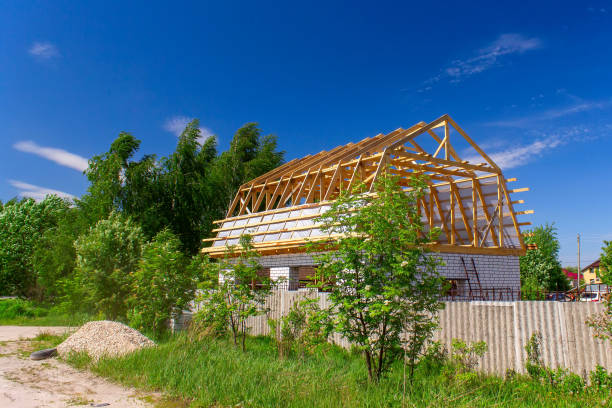 istock A new house under construction in countryside. 1197882164
