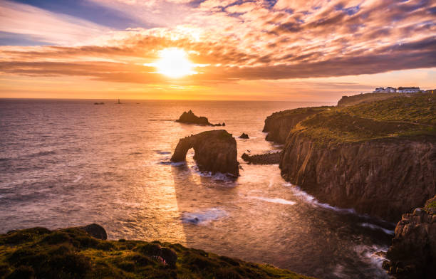 istock Dramatic sky at sunset with Enys Dodnan and the Armed Knight rock formations at Lands End 1197883815