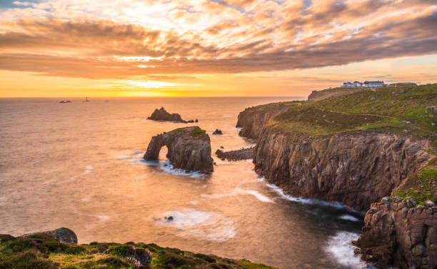 istock Dramatic sky at sunset with Enys Dodnan and the Armed Knight rock formations at Lands End 1197883863