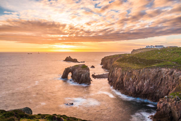 istock Dramatic sky at sunset with Enys Dodnan and the Armed Knight rock formations at Lands End 1197883888