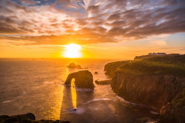 istock Dramatic sky at sunset with Enys Dodnan and the Armed Knight rock formations at Lands End 1197883951